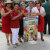 members from Ministers of the Eucharist Spanish ministry holding a sign